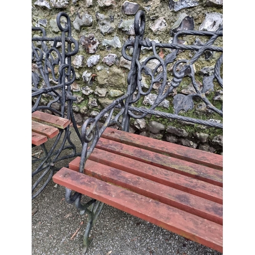 1291 - A pair of steel or cast iron garden benches, total width 122cm. (2)