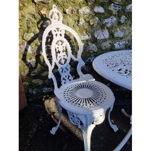 1318 - A white painted aluminium garden table and two chairs, the table 68.5cm diameter. (3)... 