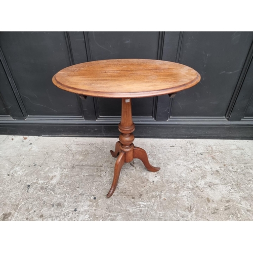 1319 - A 19th century mahogany oval tilt-top tripod table, 68.5cm wide.