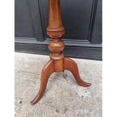 1319 - A 19th century mahogany oval tilt-top tripod table, 68.5cm wide.