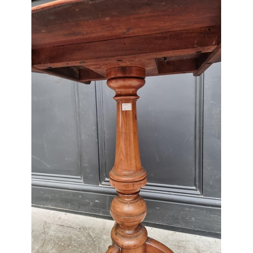 1319 - A 19th century mahogany oval tilt-top tripod table, 68.5cm wide.