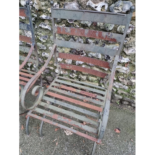 1320 - A pair of green painted steel garden chairs.