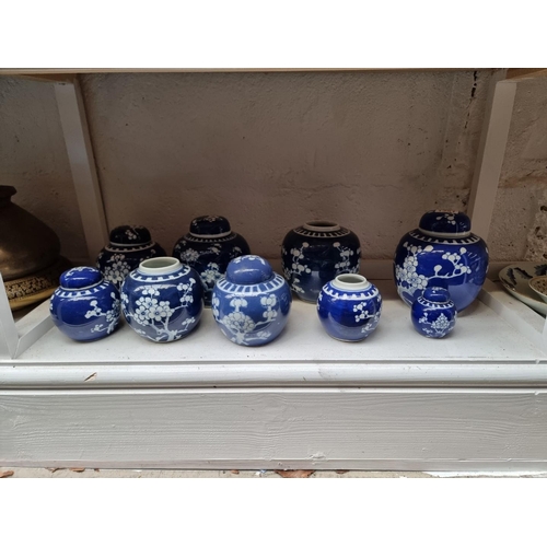 1351 - Nine Chinese blue and white ginger jars and five covers, largest 15cm high. (9)... 