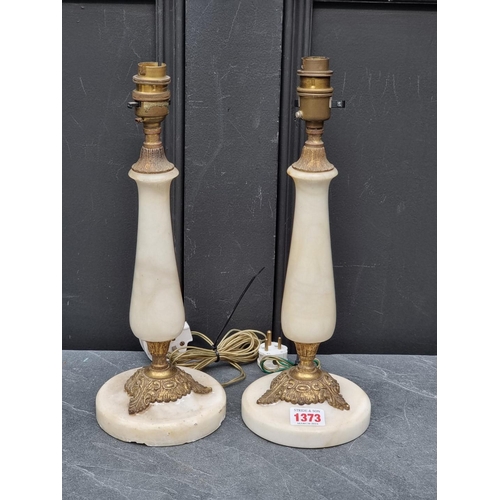 1373 - A pair of alabaster and brass table lamps, total height 33cm, (chips to base of one). (2)... 