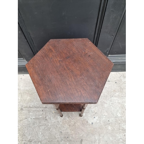 1220 - A small oak hexagonal occasional table, 35.5cm wide; together with an Edwardian mahogany and satinwo... 