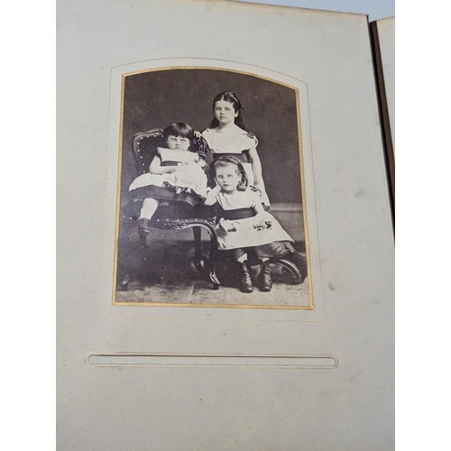 127 - CARTES DES VISITE ALBUM: a Victorian album containing approx 70+ cdv and cabinet cards, padded soft ... 