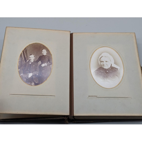 127 - CARTES DES VISITE ALBUM: a Victorian album containing approx 70+ cdv and cabinet cards, padded soft ... 