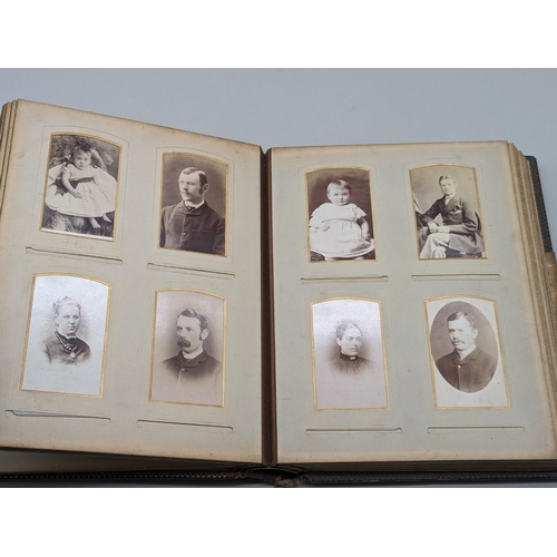 127 - CARTES DES VISITE ALBUM: a Victorian album containing approx 70+ cdv and cabinet cards, padded soft ... 