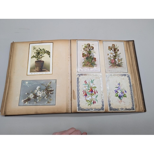 280 - SCRAPBOOK: a Victorian album of chromolithographic scraps and greetings cards, neatly arranged and p... 