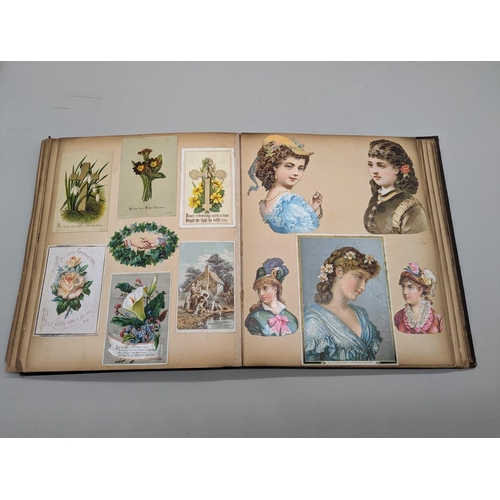 280 - SCRAPBOOK: a Victorian album of chromolithographic scraps and greetings cards, neatly arranged and p... 