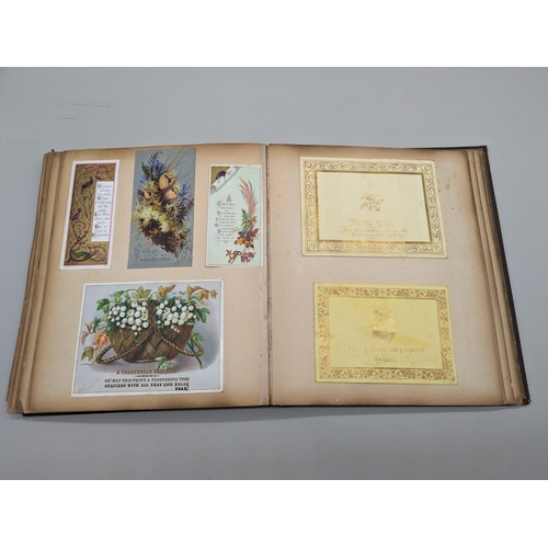 280 - SCRAPBOOK: a Victorian album of chromolithographic scraps and greetings cards, neatly arranged and p... 