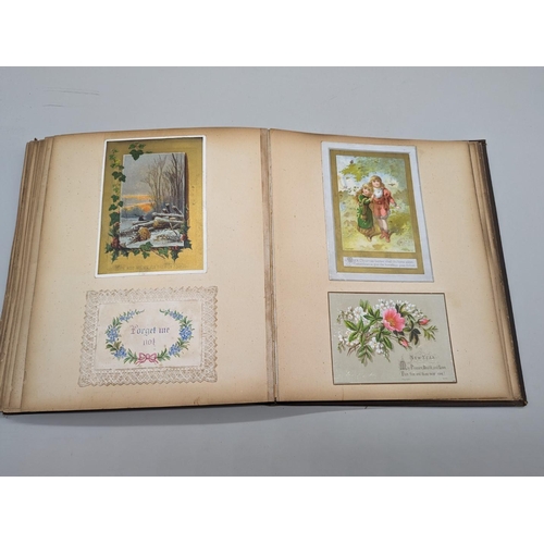 280 - SCRAPBOOK: a Victorian album of chromolithographic scraps and greetings cards, neatly arranged and p... 