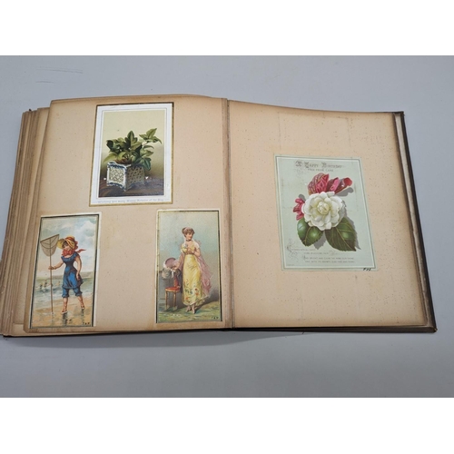 280 - SCRAPBOOK: a Victorian album of chromolithographic scraps and greetings cards, neatly arranged and p... 