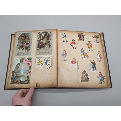 280 - SCRAPBOOK: a Victorian album of chromolithographic scraps and greetings cards, neatly arranged and p... 