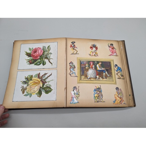 280 - SCRAPBOOK: a Victorian album of chromolithographic scraps and greetings cards, neatly arranged and p... 