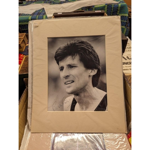 285 - FOOTBALL: a quantity of signed photographs, newspaper cuttings and album leaves, some in window... 