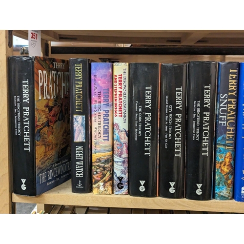 351 - PRATCHETT (Terry): a collection of 43 volumes by Pratchett over 2 shelves, some first editions, gene... 