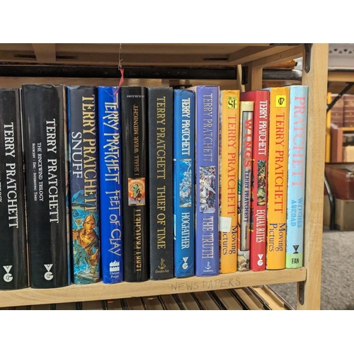 351 - PRATCHETT (Terry): a collection of 43 volumes by Pratchett over 2 shelves, some first editions, gene... 