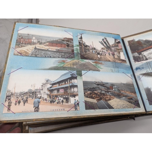 354 - POSTCARDS: oriental black lacquer album of approx 64 postcards, early tinted views predominantl... 