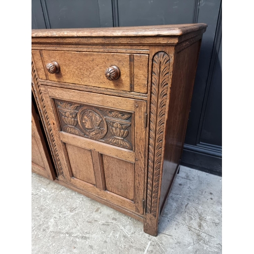 1219 - A reproduction oak draw leaf refectory table, 136.5cm when closed; together with a matching side cab... 