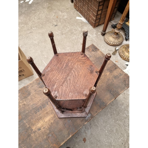 1220 - A small oak hexagonal occasional table, 35.5cm wide; together with an Edwardian mahogany and satinwo... 