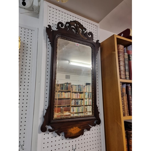 1325 - A Georgian mahogany and inlaid fret framed wall mirror, 91 x 50cm.