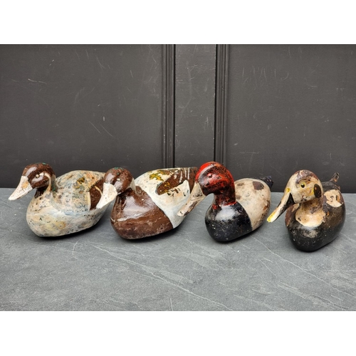 1342 - Four painted and stained wood decoy ducks. (4)