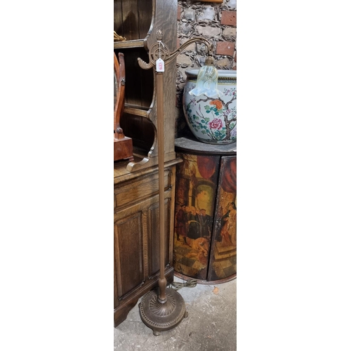 1376 - A brass standard lamp, stamped 'Alwyn', with Vaseline glass shade, 141cm high.