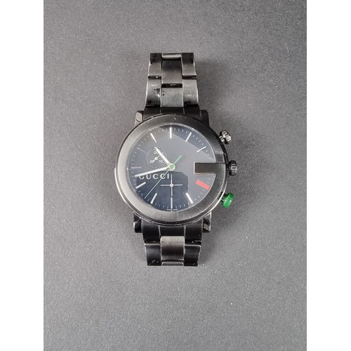 1183 - A Gucci 101M G-Chrono black PVD quartz wristwatch, 44mm; together with another wristwatch. (2)... 