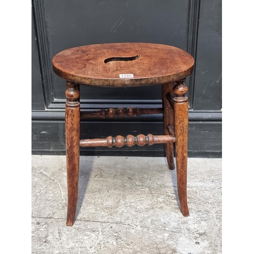 1288 - A Victorian elm and beech stool.