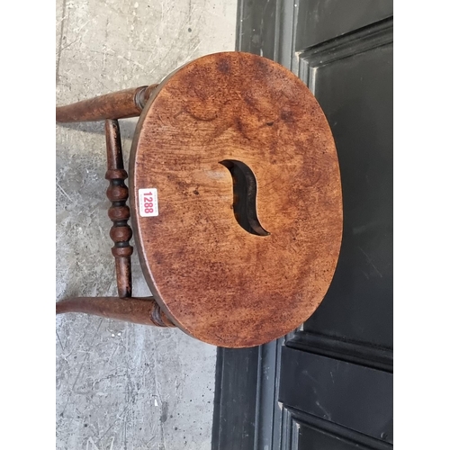 1288 - A Victorian elm and beech stool.