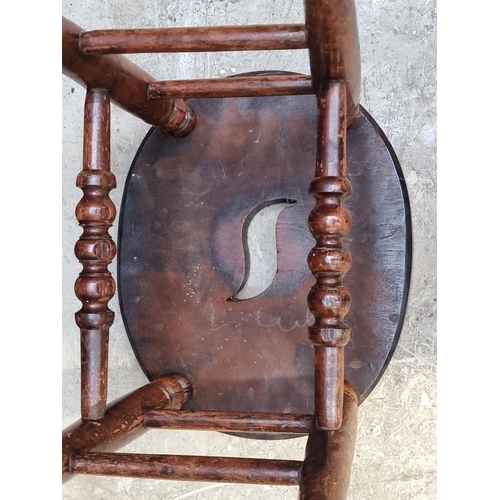 1288 - A Victorian elm and beech stool.