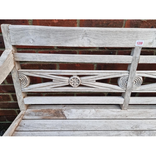 1330 - A teak garden bench, 112cm wide.