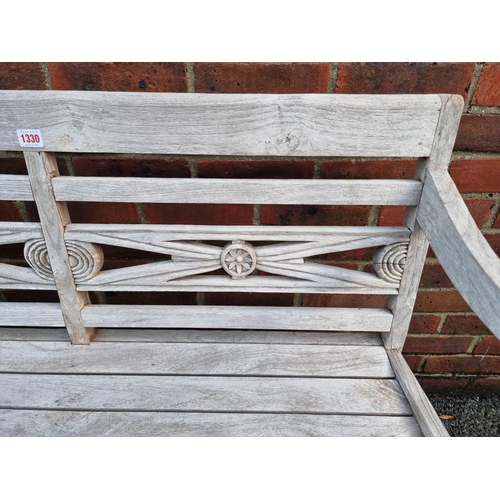 1330 - A teak garden bench, 112cm wide.