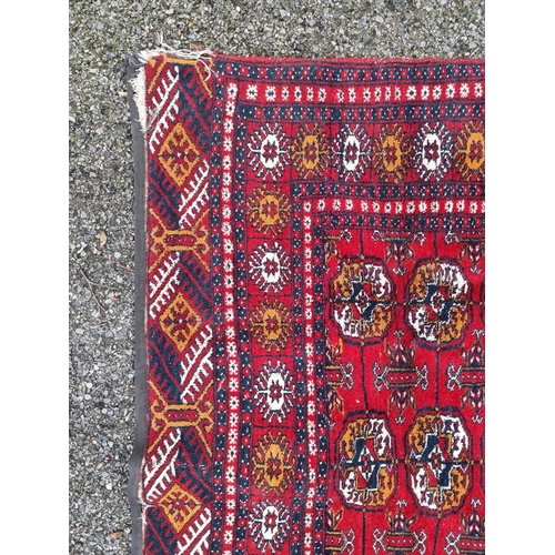 1757 - A small Bokhara rug, having repeated decoration, on red ground, 198 x 124cm.