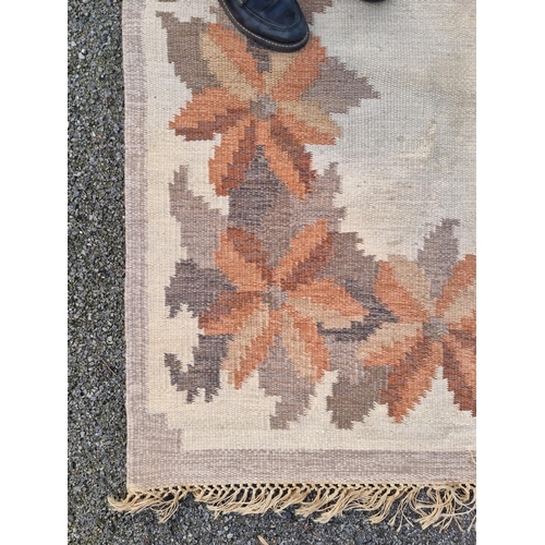 1760 - A Swedish flat weave woollen rug, with floral decoration, 204 x 138cm.