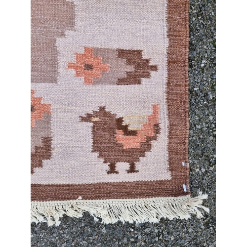 1761 - A Swedish flat weave woollen rug, with bird decoration to borders, 200 x 142cm.