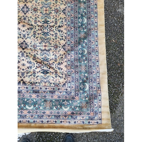 1763 - A large Kashmiri carpet, having allover floral decoration, 370 x 246cm.