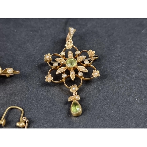 1004 - A Victorian peridot and split pearl bar brooch, stamped '15c', 50mm wide; together with a similar pe... 