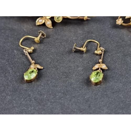 1004 - A Victorian peridot and split pearl bar brooch, stamped '15c', 50mm wide; together with a similar pe... 