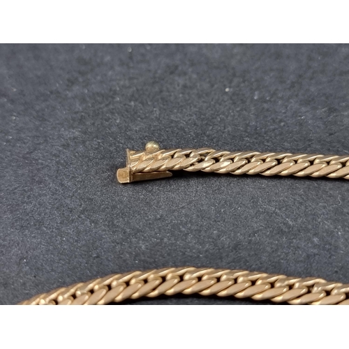 1014 - A 9ct gold chain, 44cm long, 11.2g.