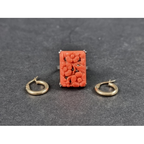 1017 - A coral ring, stamped 18ct, size M 1/2; together with a pair of hoop earrings, stamped 375. (3)... 