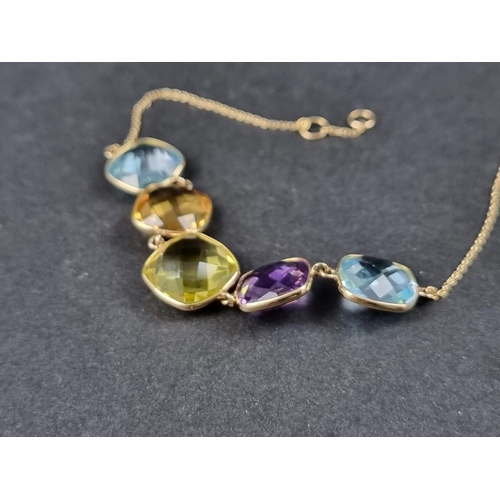 1022 - A yellow metal fine link bracelet, set five fancy cut blue topaz, citrine and amethysts, the clasp s... 