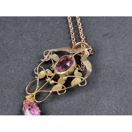 1024 - An Edwardian tourmaline pendant, stamped 9ct, approx. 41mm, on a fine chain with barrel clasp stampe... 