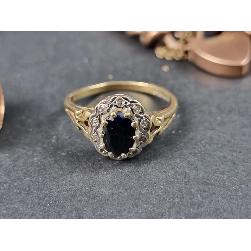 1031 - A 9ct gold ring sapphire and diamond cluster ring, size M; together with a 9ct gold ladies manual wi... 