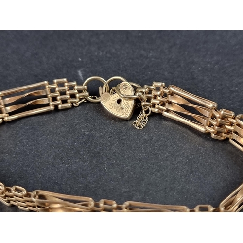 1048 - A 9ct gold gate link bracelet, having padlock clasp, 18cm long; together with various other 9ct gold... 