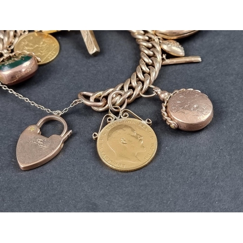 1049 - A charm bracelet, stamped 9c, having padlock clasp, with eleven attached gold and yellow metal charm... 