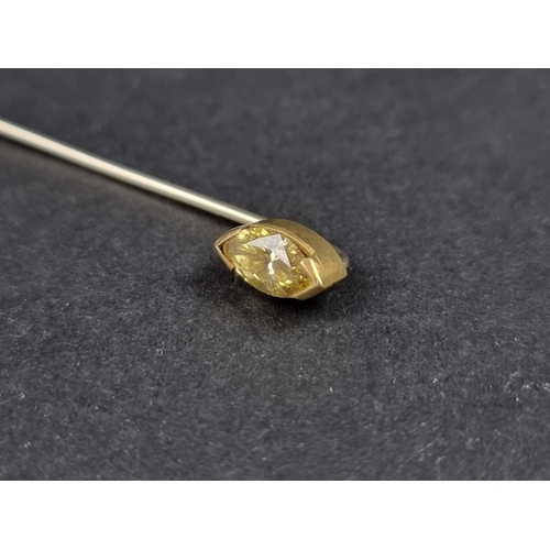 1054 - A yellow and white metal stick pin, set marquise yellow diamond, 58mm long.