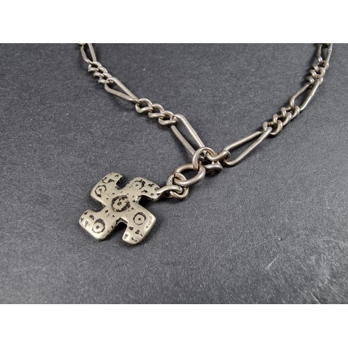 1074 - A silver watch chain, with attached metal swastika pendant, 44cm long, gross weight 27g.... 