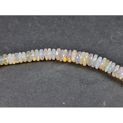 1097 - A graduated opal faceted bead necklace, with silver marcasite clasp, approx. 40cm long.... 